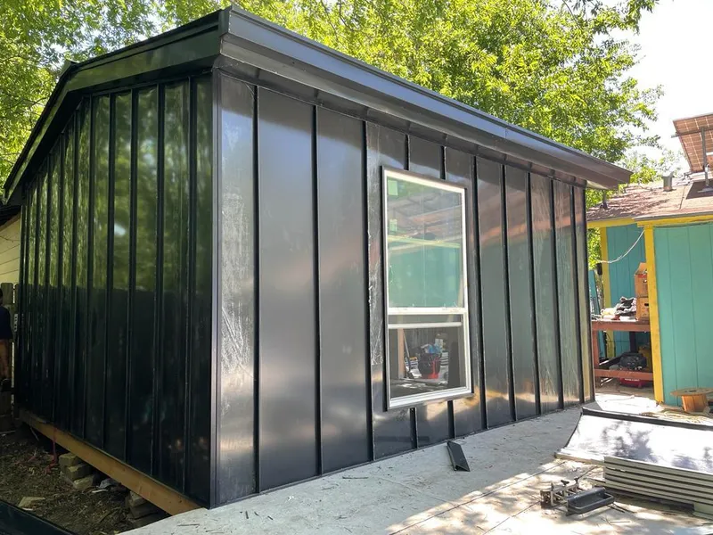 Black standing seam metal wall panels for Roof Inspection in Villas